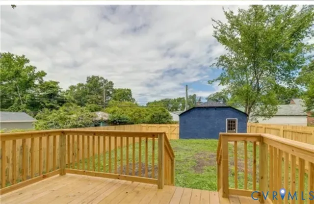 a view of a two chairs on the roof deck