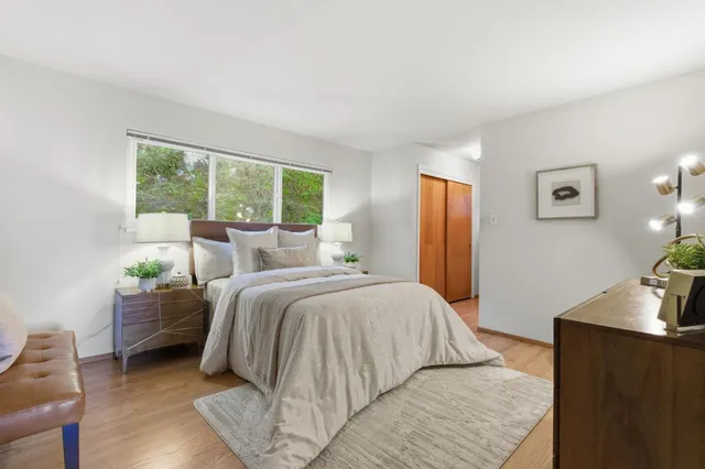 a bedroom with a bed and a dresser