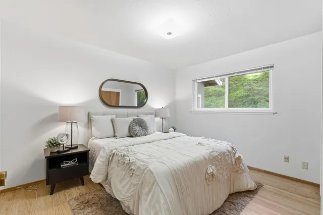 a bathroom with a shower sink vanity and toilet