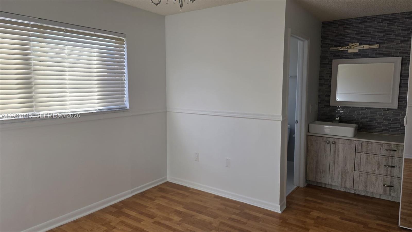 14905 Southwest 80th Street, Unit 217 Miami, FL 33193 - Photo 14 of 25 a view of cabinets and window