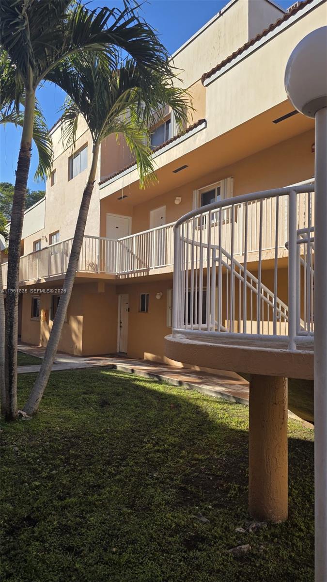 14905 Southwest 80th Street, Unit 217 Miami, FL 33193 - Photo 2 of 25 a view of swimming pool with a yard