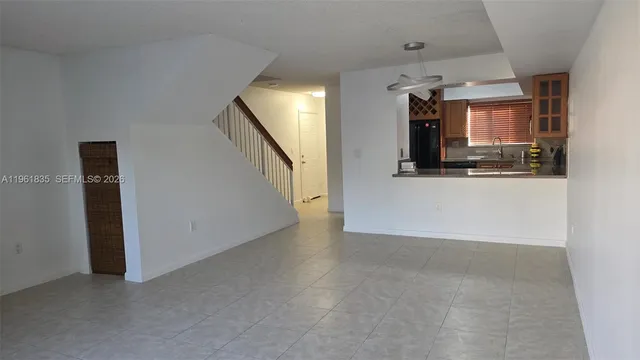 a view of a kitchen with a sink