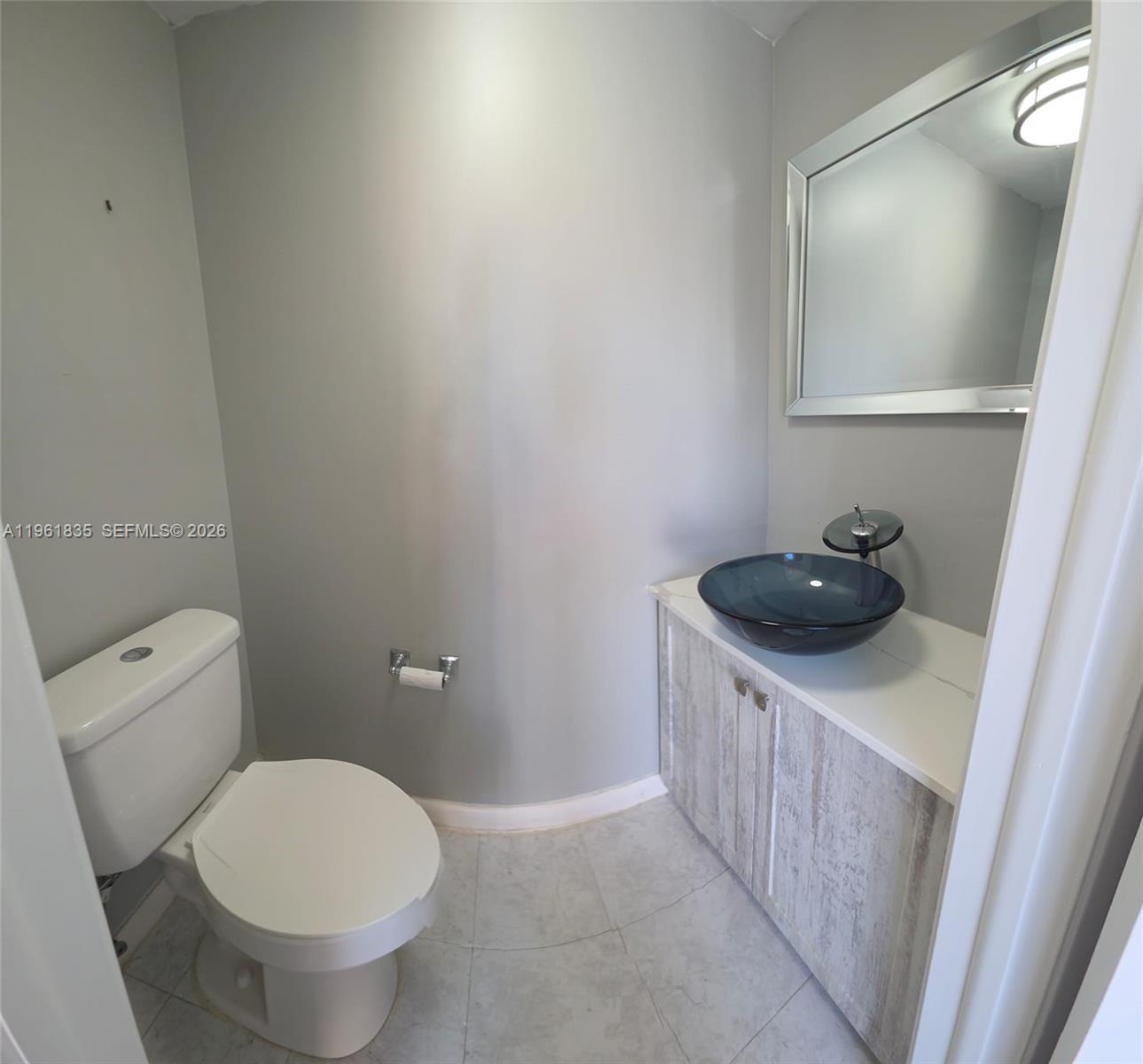 14905 Southwest 80th Street, Unit 217 Miami, FL 33193 - Photo 4 of 25 a bathroom with a sink and a toilet