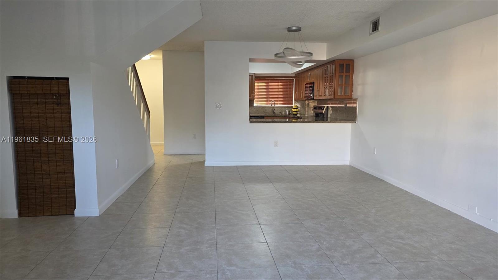 14905 Southwest 80th Street, Unit 217 Miami, FL 33193 - Photo 7 of 25 a view of a kitchen and a window