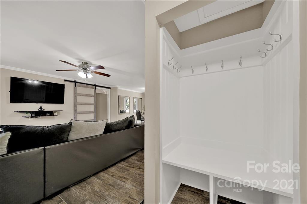 2430 Rice Planters Road Charlotte, NC 28273 - Photo 2 of 42 a living room with furniture and a flat screen tv