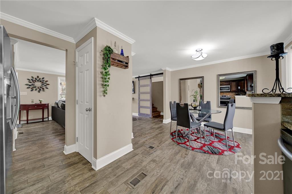 2430 Rice Planters Road Charlotte, NC 28273 - Photo 12 of 42 a view of a livingroom with wooden floor and furniture