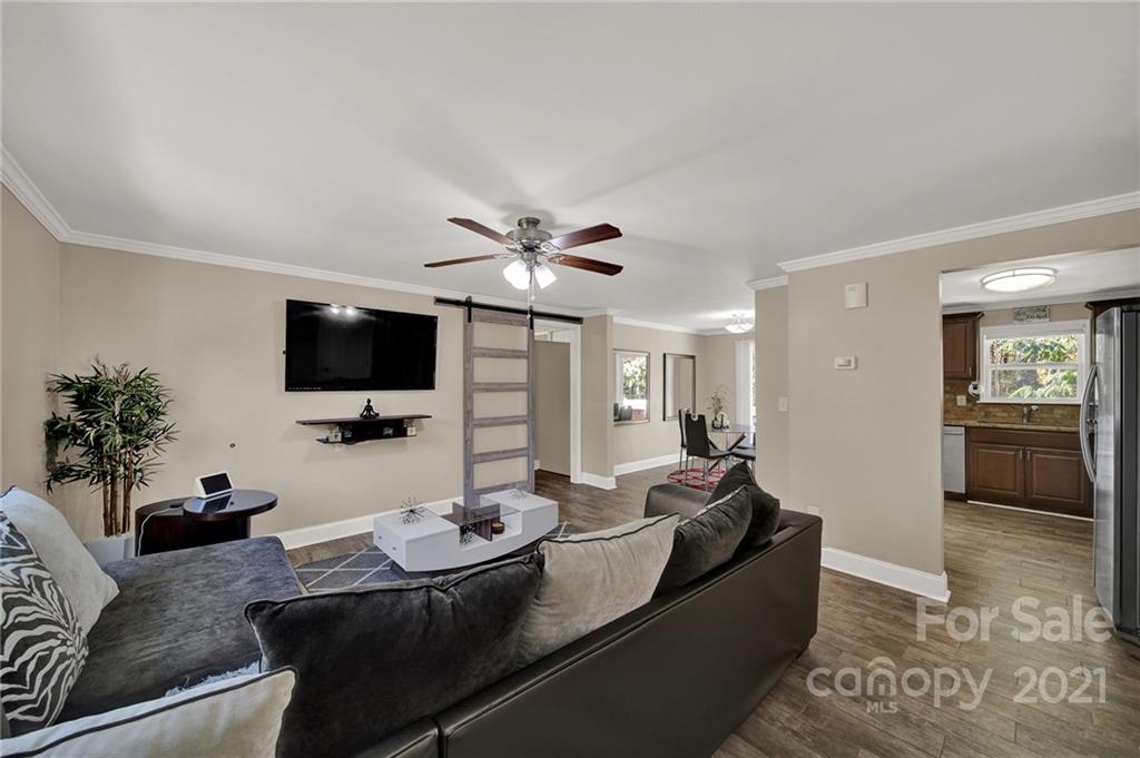 2430 Rice Planters Road Charlotte, NC 28273 - Photo 3 of 42 a living room with furniture and a flat screen tv