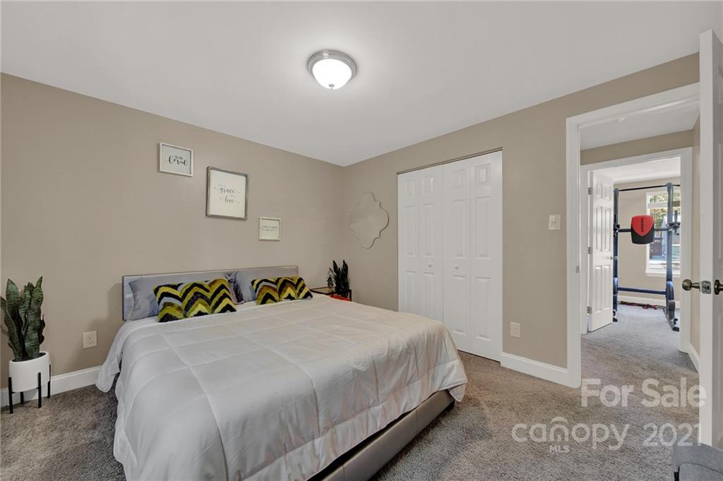 2430 Rice Planters Road Charlotte, NC 28273 - Photo 24 of 42 a bedroom with a bed and table