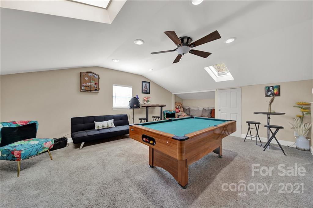 2430 Rice Planters Road Charlotte, NC 28273 - Photo 26 of 42 a room with furniture and a ceiling fan