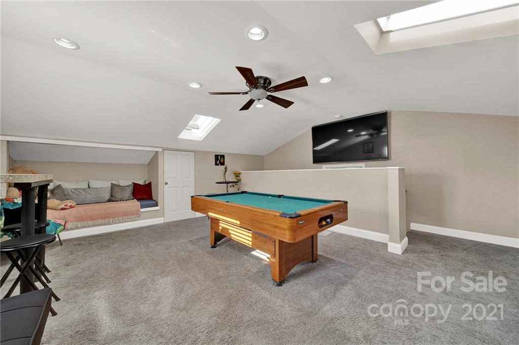 2430 Rice Planters Road Charlotte, NC 28273 - Photo 27 of 42 a room with furniture and a flat screen tv