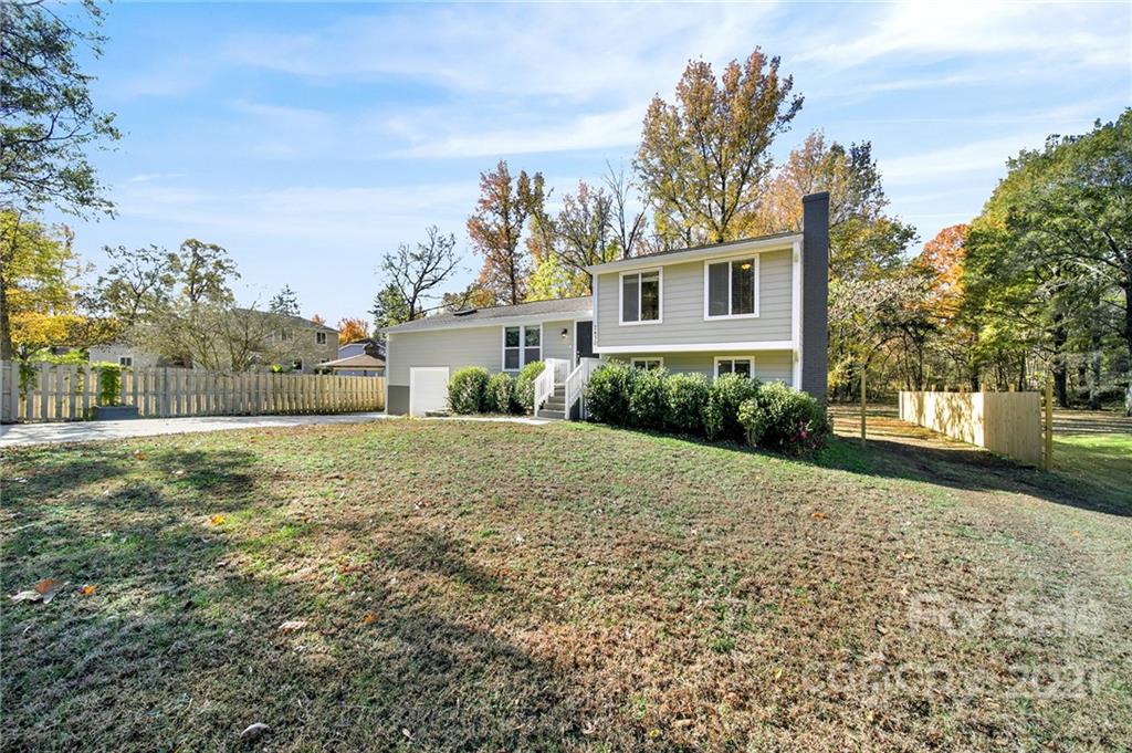 2430 Rice Planters Road Charlotte, NC 28273 - Photo 38 of 42 a front view of a house with garden