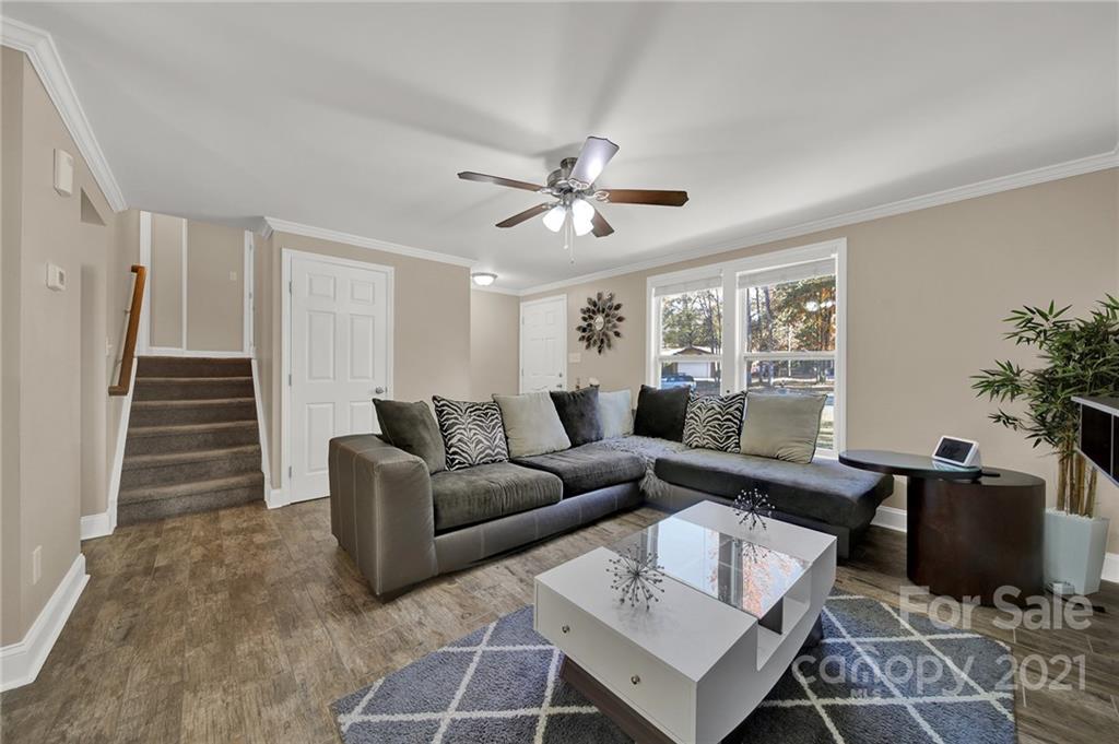 2430 Rice Planters Road Charlotte, NC 28273 - Photo 6 of 42 a living room with furniture potted plant and a window