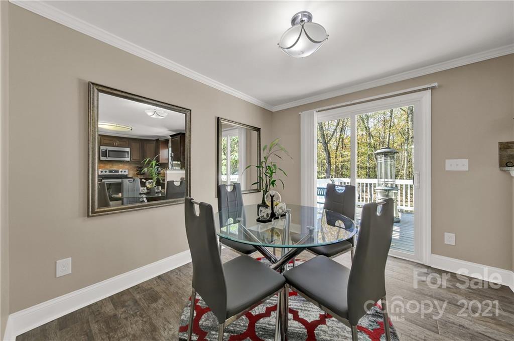 2430 Rice Planters Road Charlotte, NC 28273 - Photo 7 of 42 a view of a dining room with furniture window and wooden floor