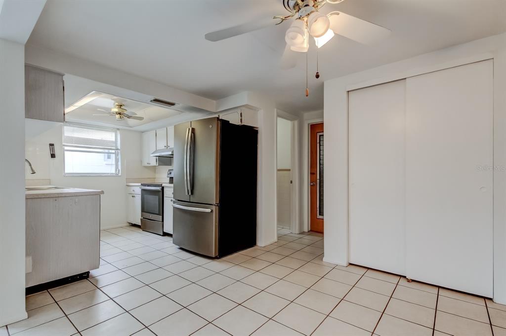 3735 Mynabird Drive New Port Richey, FL 34652 - Photo 14 of 51 a kitchen with a refrigerator and a sink