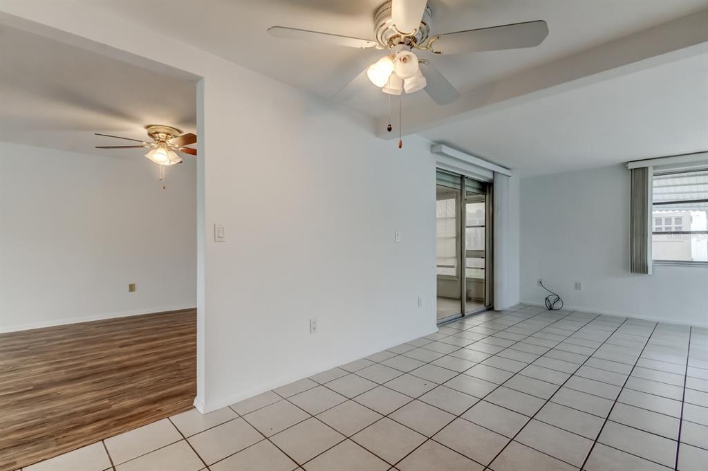 3735 Mynabird Drive New Port Richey, FL 34652 - Photo 16 of 51 wooden floor in an empty room with a window
