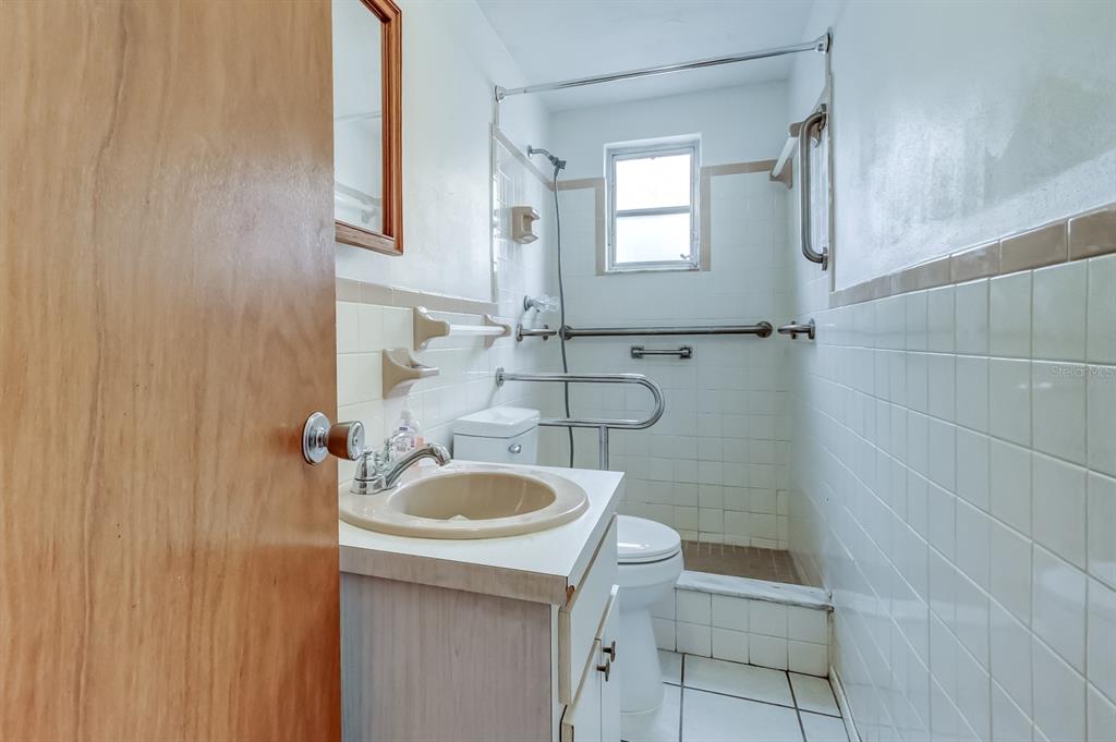 3735 Mynabird Drive New Port Richey, FL 34652 - Photo 17 of 51 a bathroom with a sink a toilet and shower