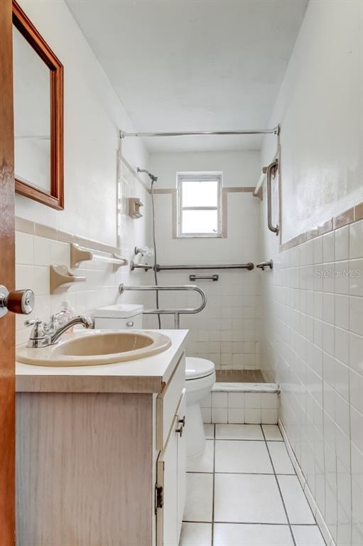 3735 Mynabird Drive New Port Richey, FL 34652 - Photo 18 of 51 a bathroom with a sink toilet and mirror