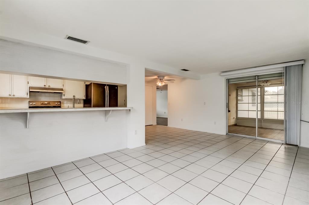 3735 Mynabird Drive New Port Richey, FL 34652 - Photo 27 of 51 a view of a kitchen with microwave and cabinets