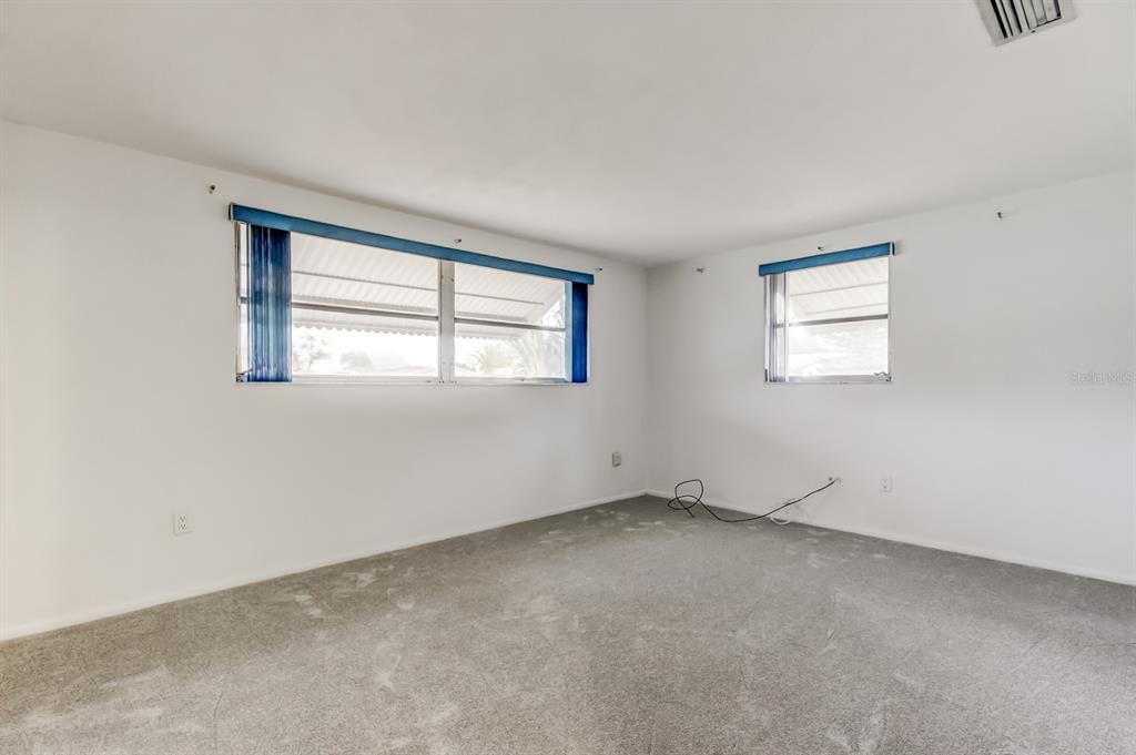 3735 Mynabird Drive New Port Richey, FL 34652 - Photo 33 of 51 an empty room with windows