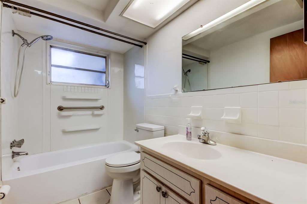 3735 Mynabird Drive New Port Richey, FL 34652 - Photo 37 of 51 a bathroom with a sink toilet vanity and tub