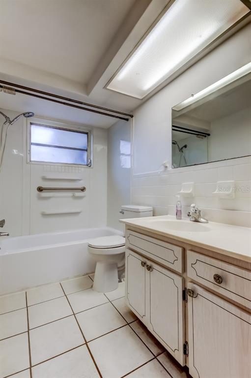 3735 Mynabird Drive New Port Richey, FL 34652 - Photo 38 of 51 a bathroom with a sink a toilet and mirror