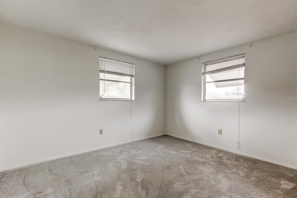 3735 Mynabird Drive New Port Richey, FL 34652 - Photo 39 of 51 an empty room with windows