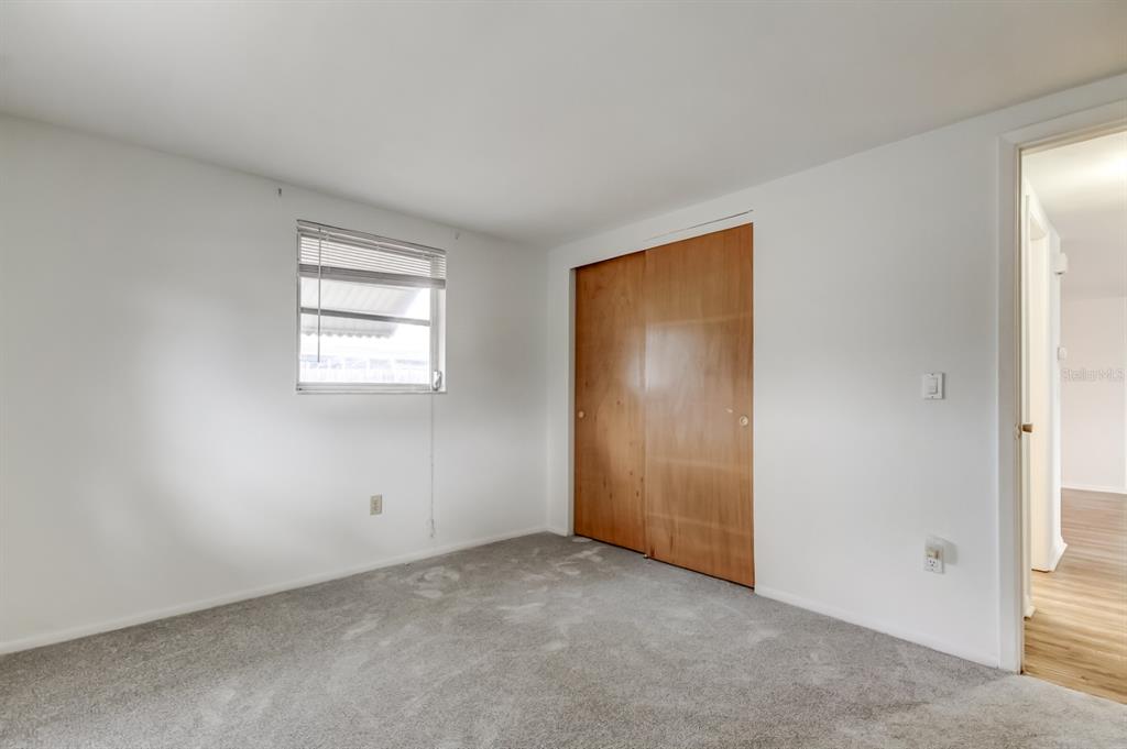 3735 Mynabird Drive New Port Richey, FL 34652 - Photo 40 of 51 an empty room with windows and closet