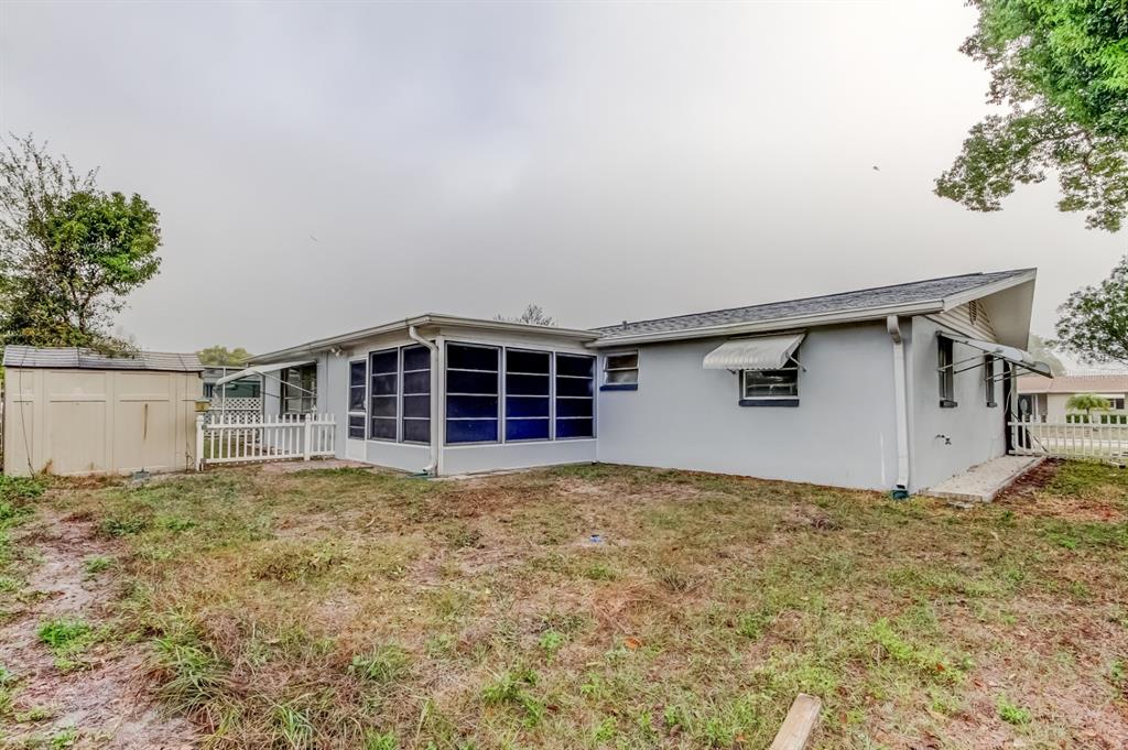 3735 Mynabird Drive New Port Richey, FL 34652 - Photo 46 of 51 front view of a house with a yard