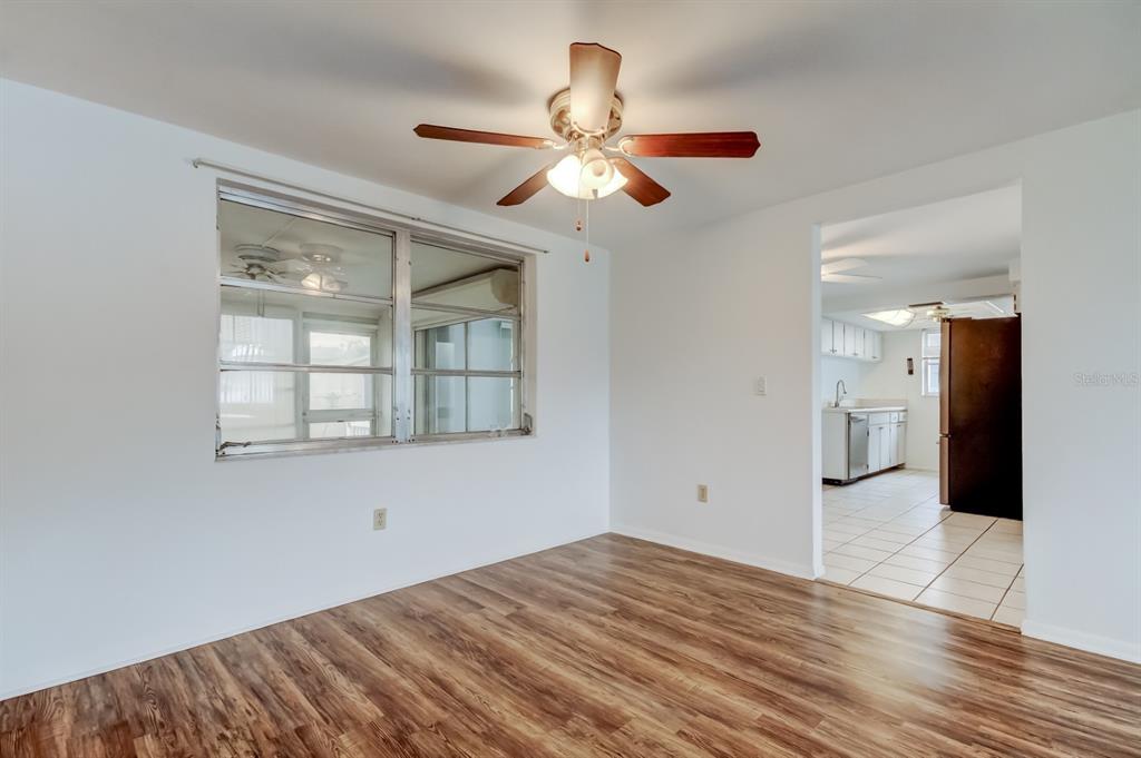 3735 Mynabird Drive New Port Richey, FL 34652 - Photo 5 of 51 a view of empty room with wooden floor and fan