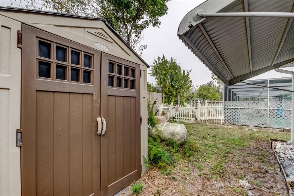 3735 Mynabird Drive New Port Richey, FL 34652 - Photo 51 of 51 a backyard of a house with lots of green space