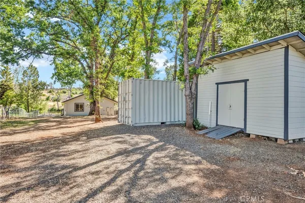a view of a house with a yard and garage