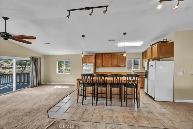a view of kitchen with furniture stove and refrigerator