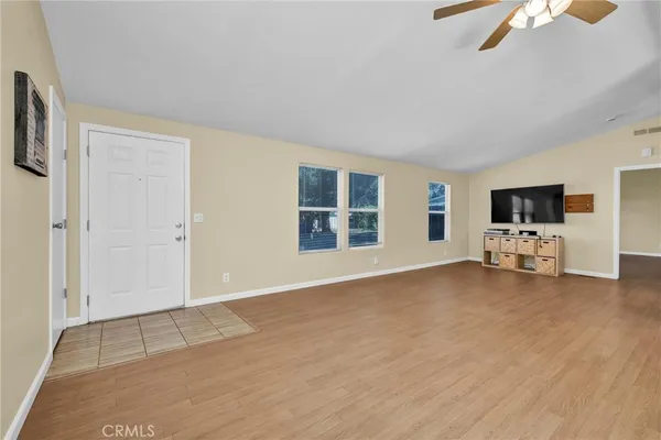 a view of livingroom with furniture and flat screen tv