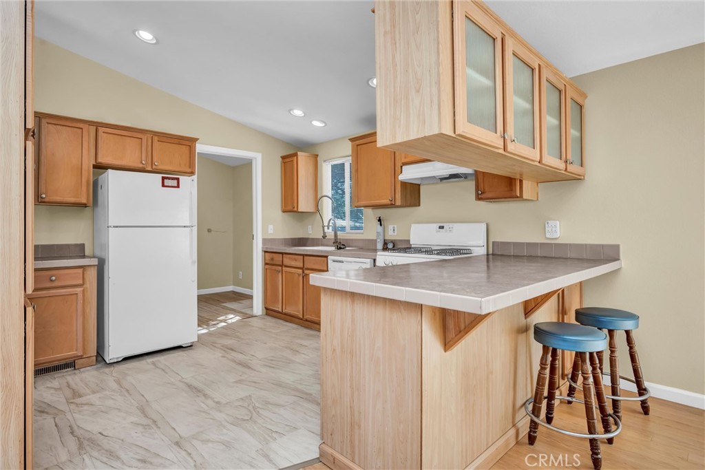16410 Tish-A-Tang Road Lower Lake, CA 95457 - Photo 29 of 52 a kitchen with a sink cabinets and refrigerator