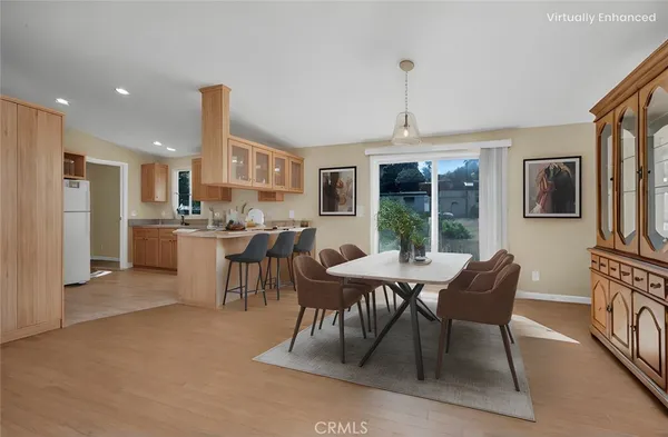 a view of a dining room with furniture window and outside view