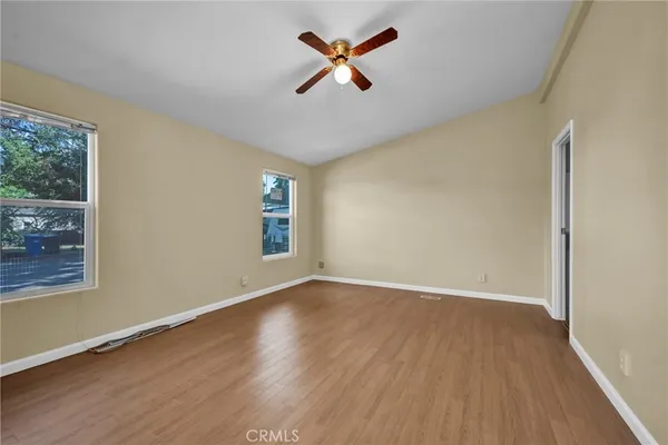 a bedroom with a bed and a television