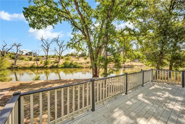 a view of a balcony with trees