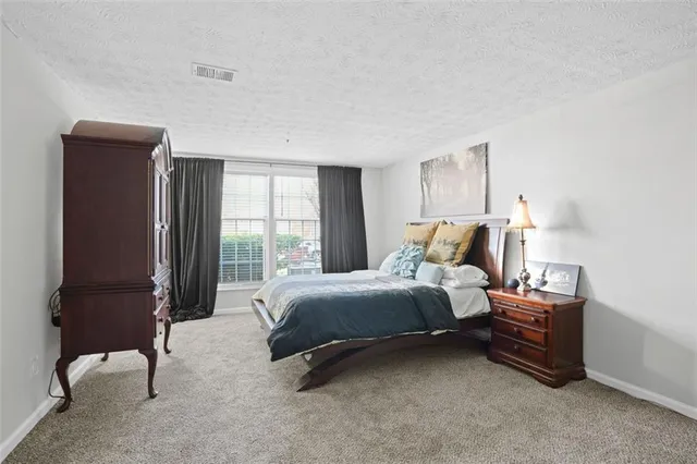 a bed room with a bed and a window