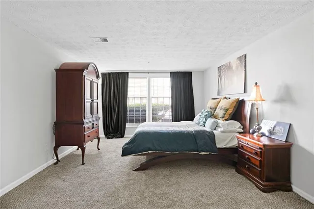 a bed room with a bed and a window