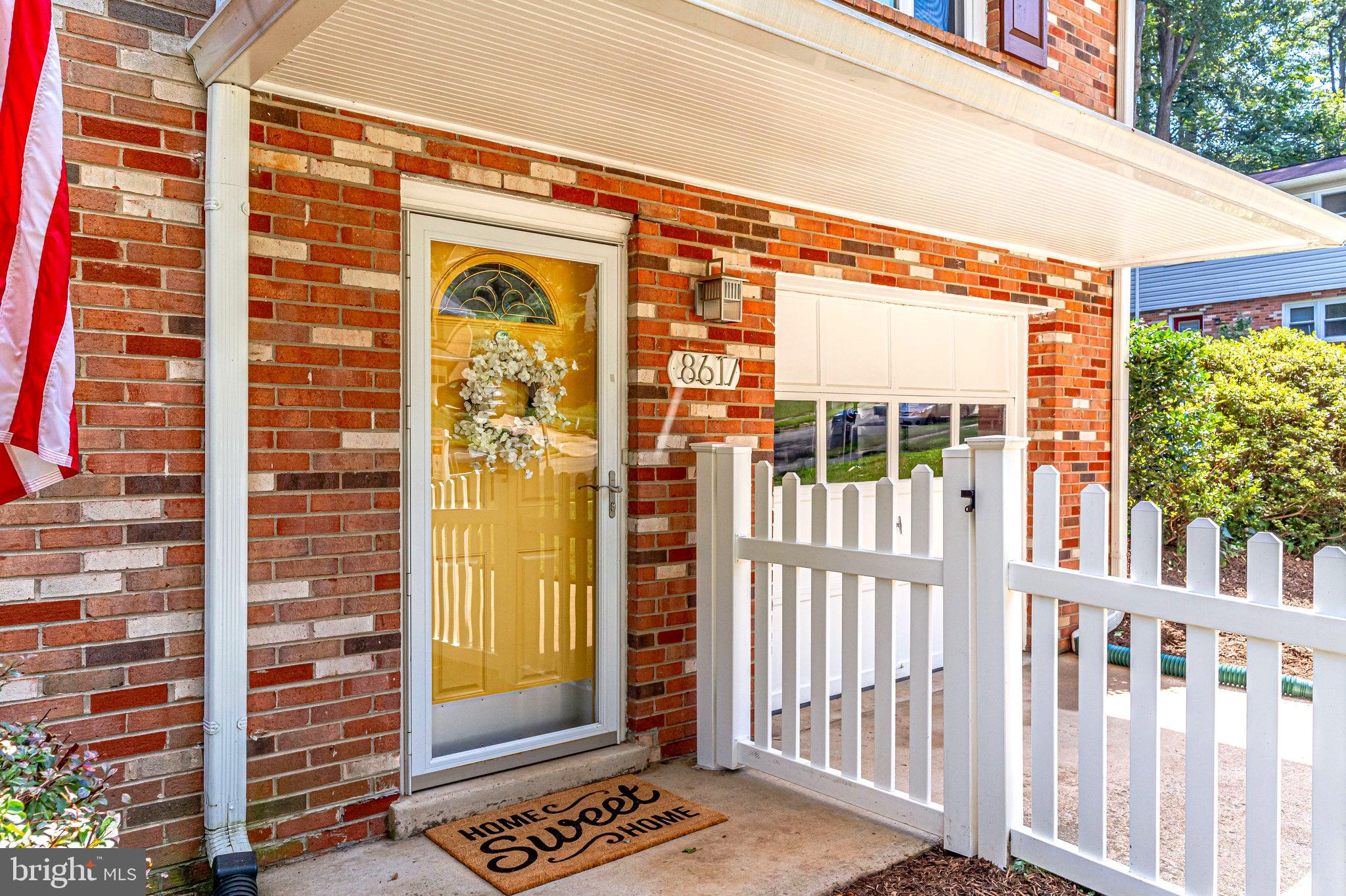 Inviting Front Door Entrance with Portico
