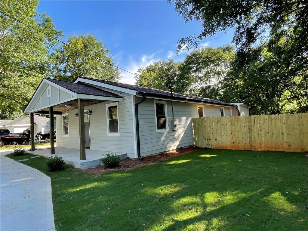 421 Maple Lane Monroe, GA 30655 - Photo 1 of 1 a view of a backyard with a garden