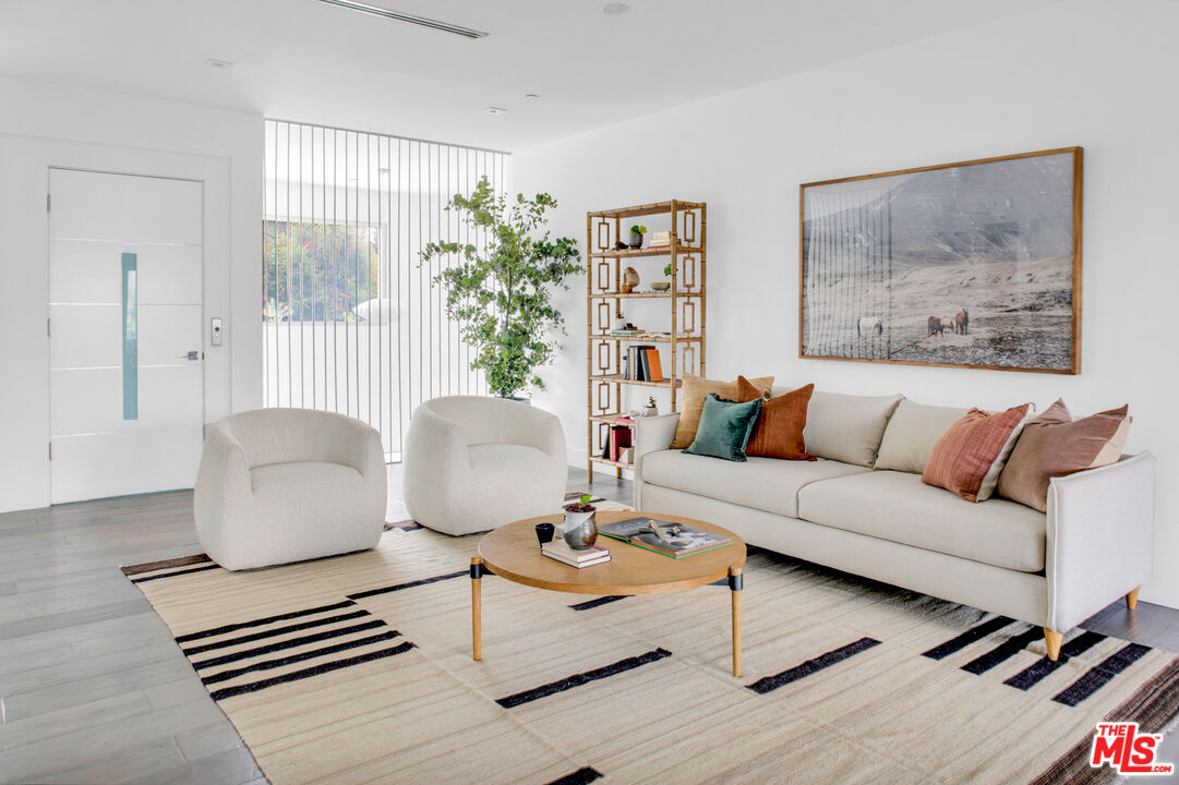 2945 Angus Street Los Angeles, CA 90039 - Photo 20 of 52 a living room with furniture and a large window