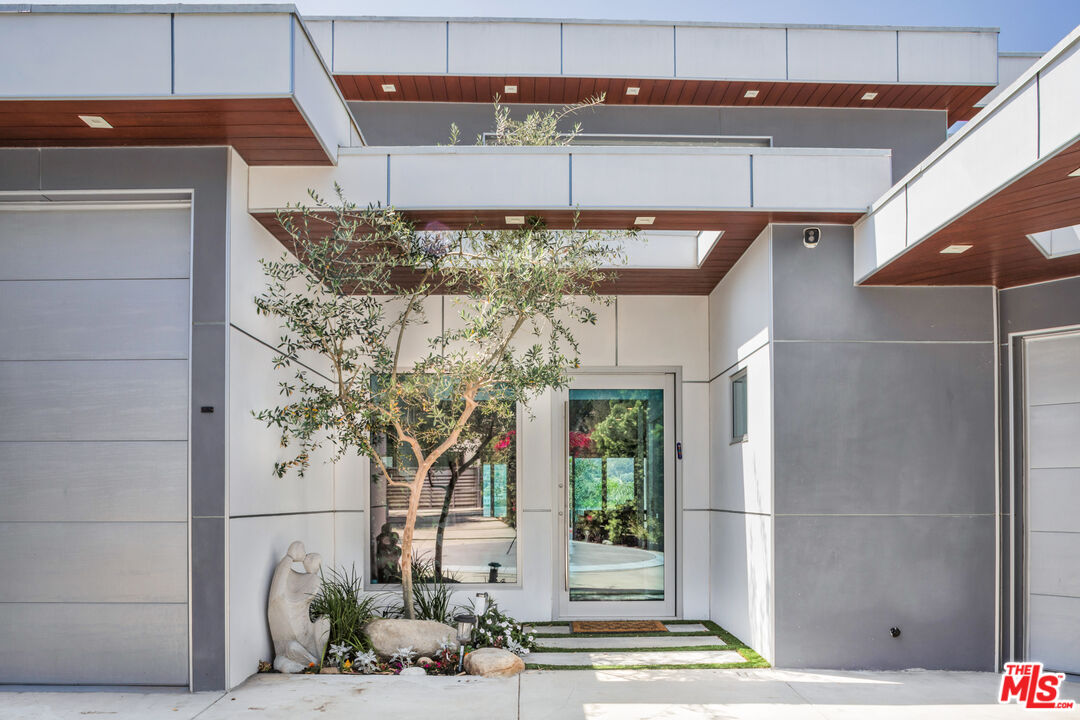 2945 Angus Street Los Angeles, CA 90039 - Photo 2 of 52 a vase of flowers sitting on a wall