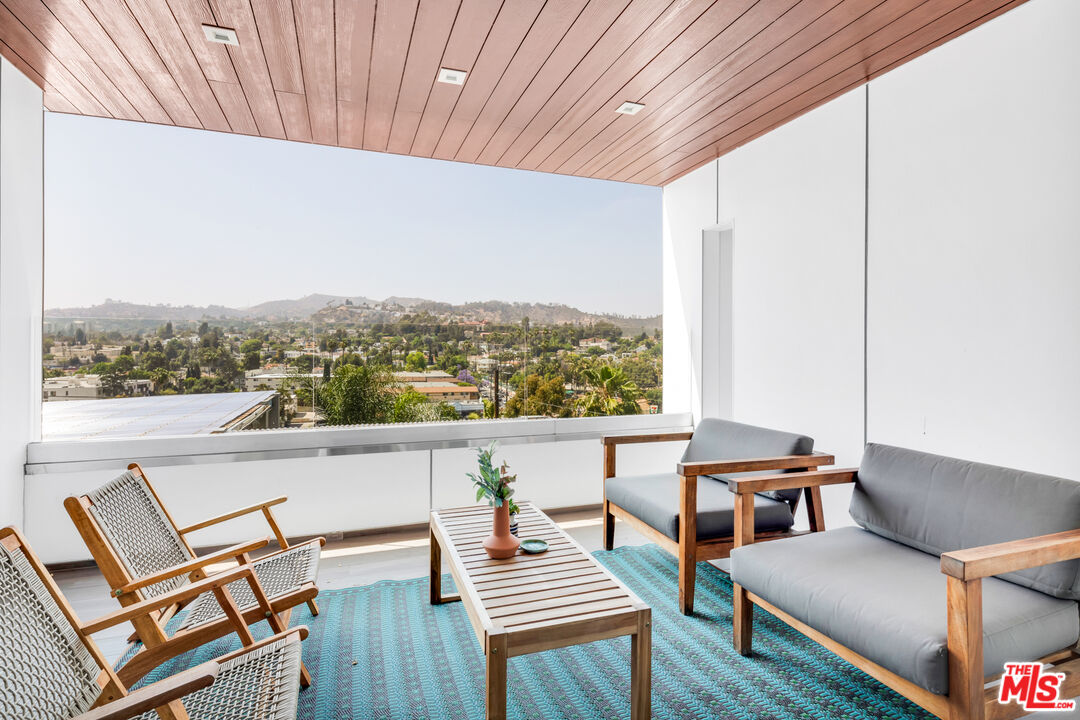 2945 Angus Street Los Angeles, CA 90039 - Photo 23 of 52 an outdoor view from a balcony with furniture