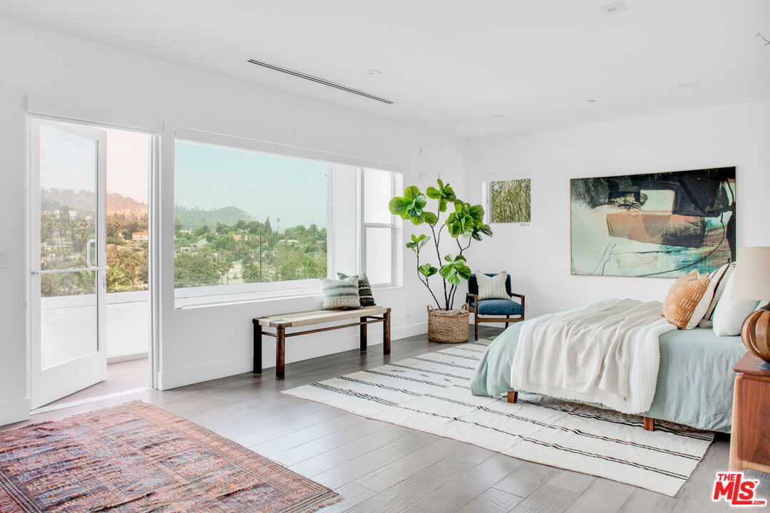 2945 Angus Street Los Angeles, CA 90039 - Photo 24 of 52 a bedroom with furniture and a potted plant