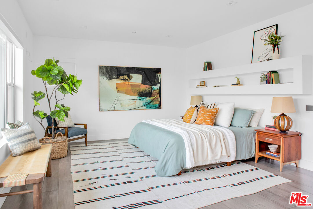 2945 Angus Street Los Angeles, CA 90039 - Photo 25 of 52 a bedroom with a bed and a potted plant