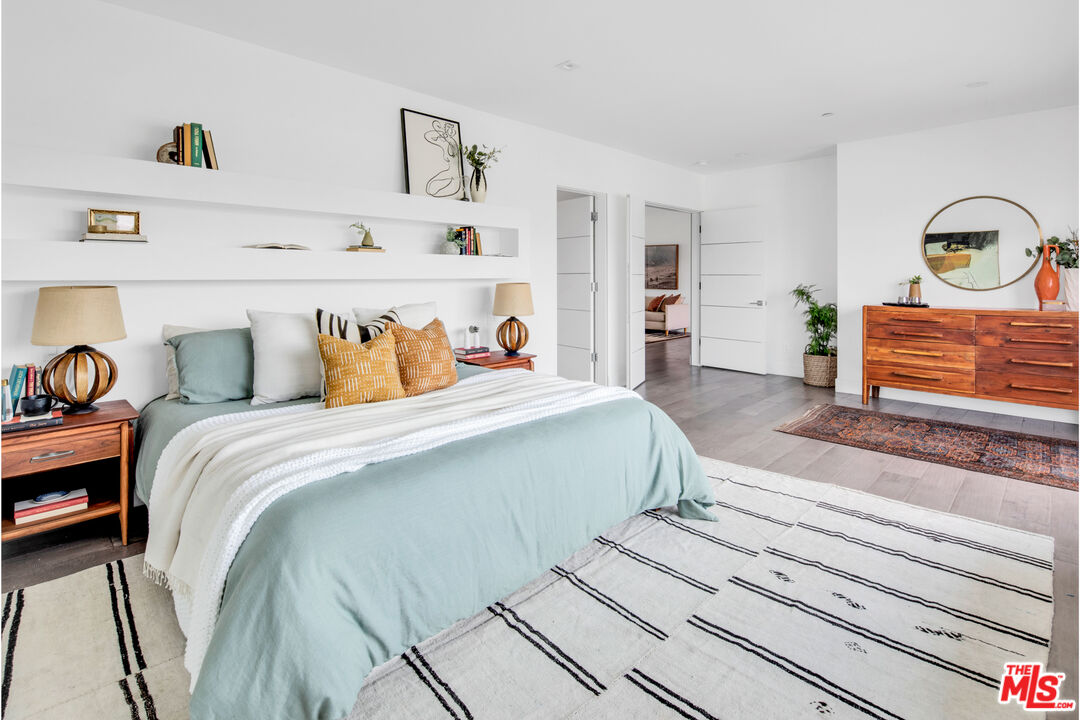 2945 Angus Street Los Angeles, CA 90039 - Photo 26 of 52 a bedroom with bed and wooden floor