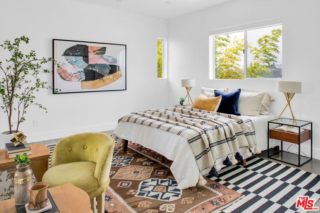 2945 Angus Street Los Angeles, CA 90039 - Photo 30 of 52 a bedroom with a bed and wooden floor