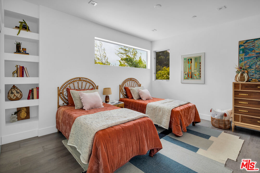 2945 Angus Street Los Angeles, CA 90039 - Photo 32 of 52 a bedroom with two beds and painting on the wall