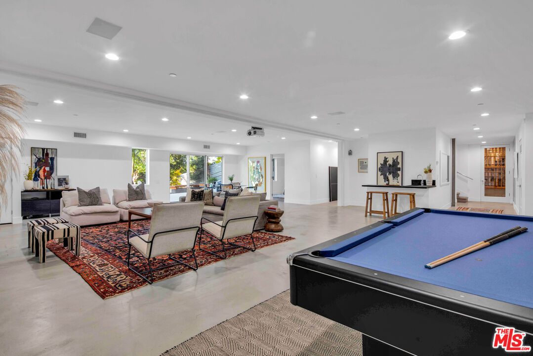 2945 Angus Street Los Angeles, CA 90039 - Photo 36 of 52 a living room with furniture pool table and windows